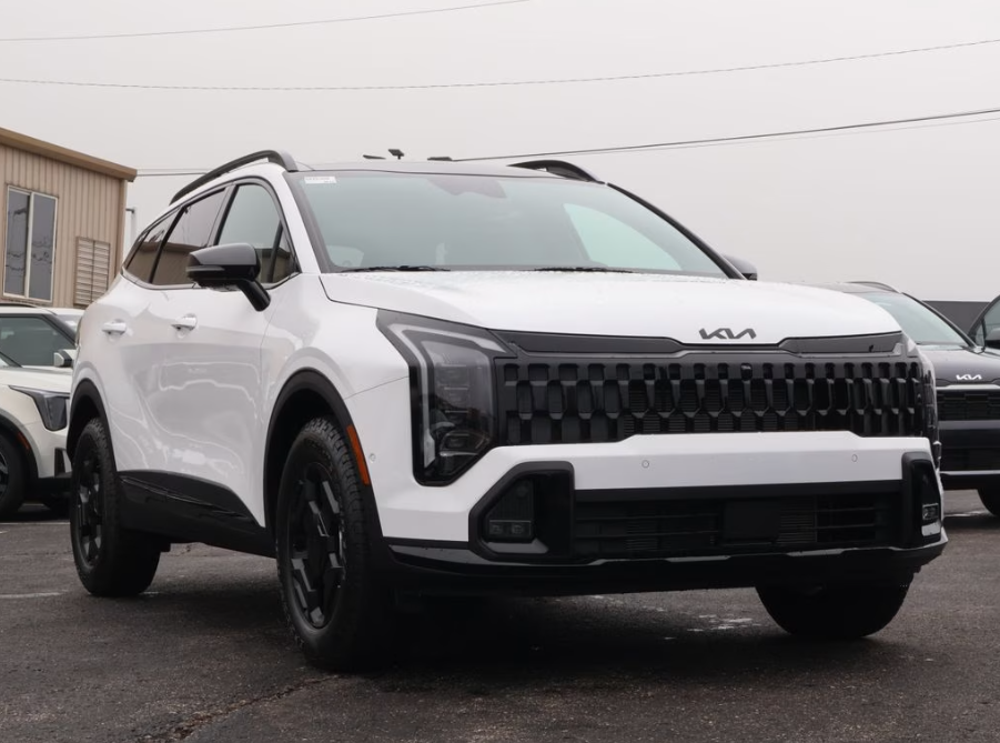 A white 2026 Kia Sportage X-Pro Prestige from Oakes Kia of Olathe